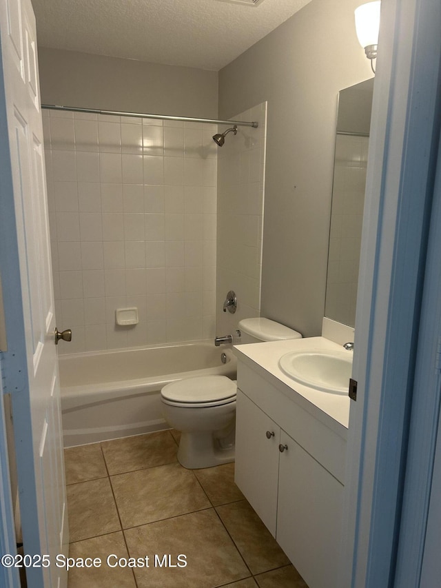 537 6th St, Vero Beach, FL 32962 - bathroom with vanity,  shower combination, tile patterned flooring, and a textured ceiling