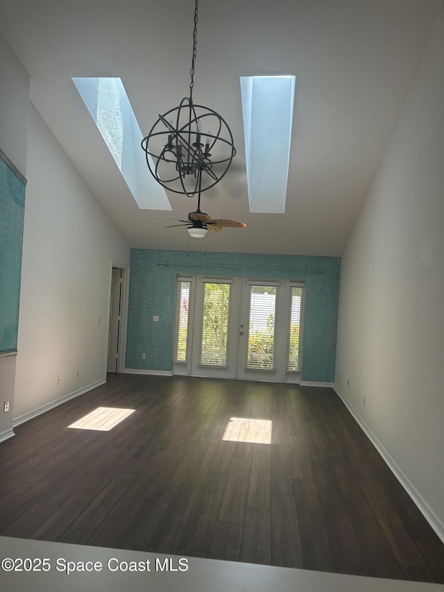 537 6th St, Vero Beach, FL 32962 - unfurnished living room with a skylight, high vaulted ceiling, a ceiling fan, wood finished floors, and a chandelier