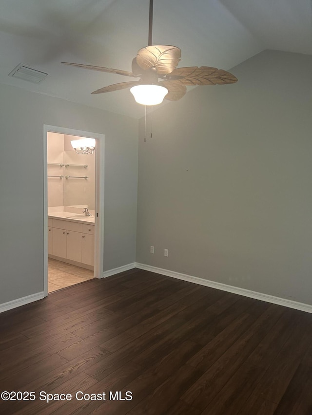 537 6th St, Vero Beach, FL 32962 - unfurnished room with wood finished floors, a ceiling fan, and vaulted ceiling