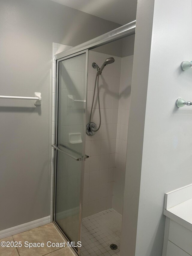 537 6th St, Vero Beach, FL 32962 - bathroom featuring a stall shower, vanity, and tile patterned floors