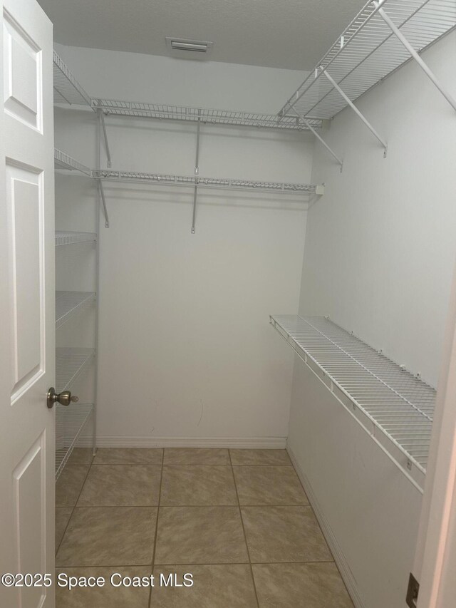 537 6th St, Vero Beach, FL 32962 - walk in closet featuring light tile patterned flooring