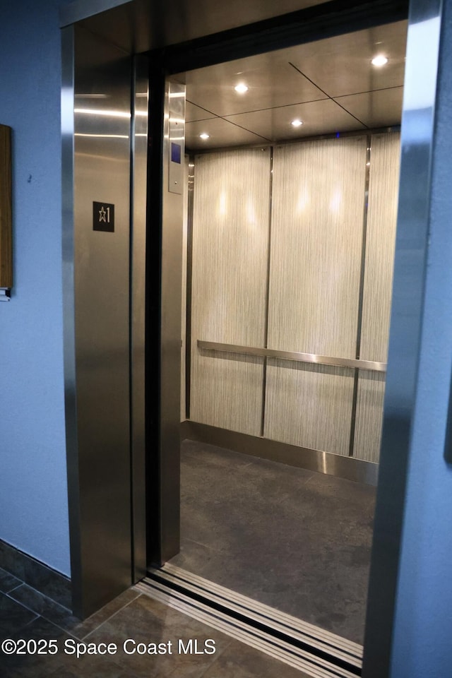 3609 S Banana River Blvd Unit C511, Cocoa Beach, FL 32931 - elevator featuring recessed lighting