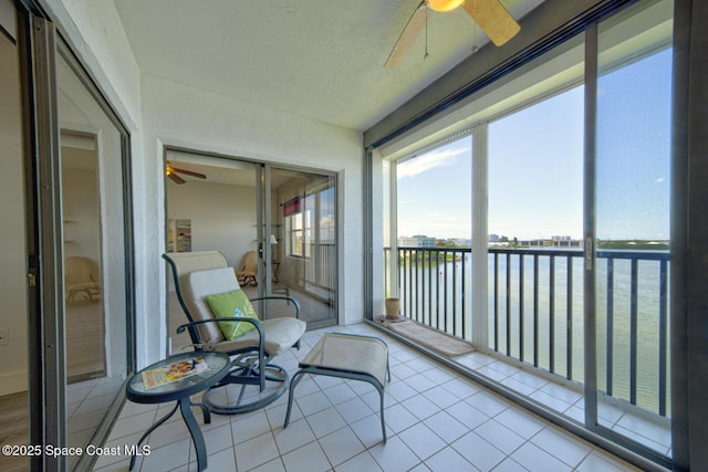 3609 S Banana River Blvd Unit C511, Cocoa Beach, FL 32931 - sunroom / solarium with ceiling fan and a water view