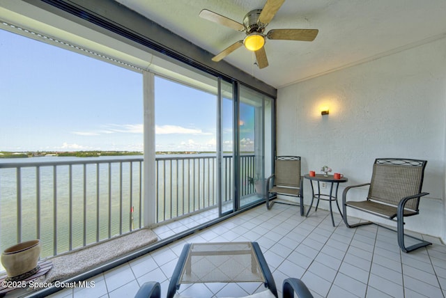 3609 S Banana River Blvd Unit C511, Cocoa Beach, FL 32931 - sunroom featuring a water view and a ceiling fan