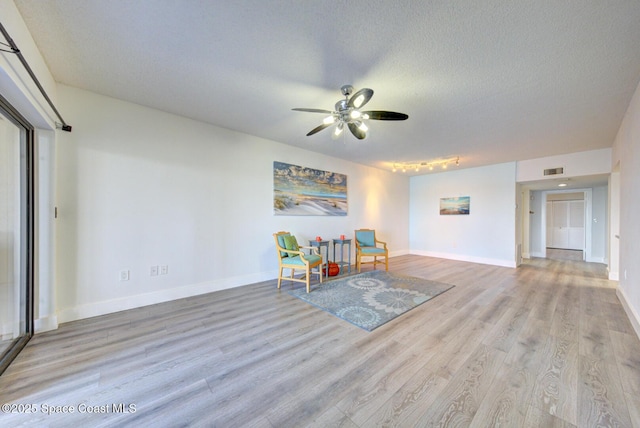 3609 S Banana River Blvd Unit C511, Cocoa Beach, FL 32931 - unfurnished room featuring a ceiling fan, wood finished floors, and a textured ceiling