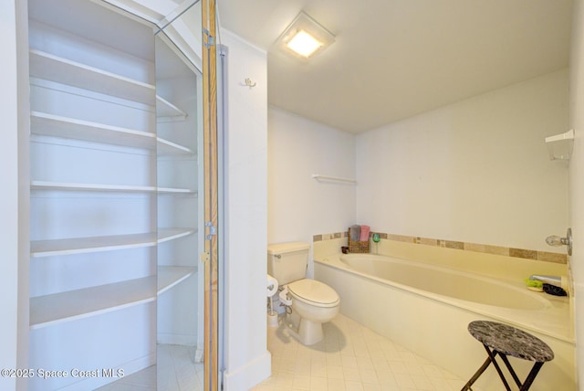 3609 S Banana River Blvd Unit C511, Cocoa Beach, FL 32931 - bathroom featuring a garden tub and tile patterned flooring
