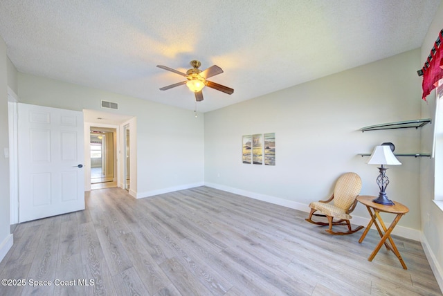 3609 S Banana River Blvd Unit C511, Cocoa Beach, FL 32931 - unfurnished room featuring ceiling fan, light wood-style floors, and a textured ceiling