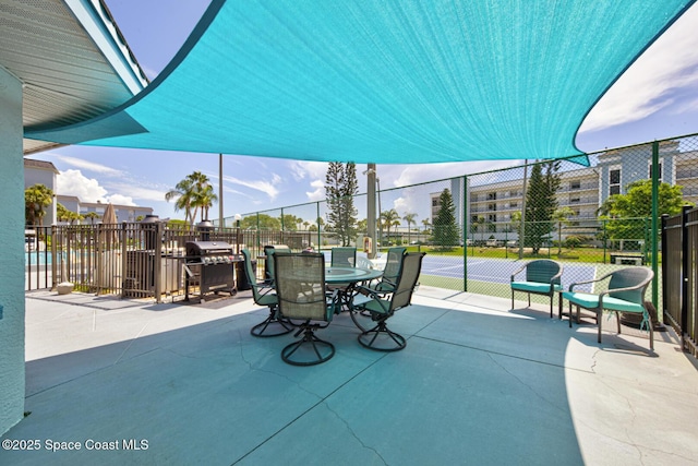 3609 S Banana River Blvd Unit C511, Cocoa Beach, FL 32931 - view of patio with area for grilling and outdoor dining area