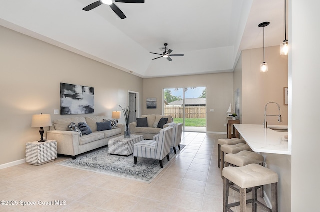 130 Cameron St SE, Palm Bay, FL 32909 - living room featuring a ceiling fan, a tray ceiling, and light tile patterned floors