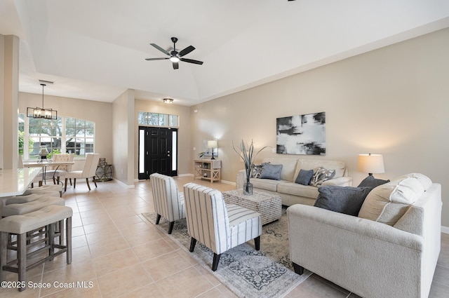 130 Cameron St SE, Palm Bay, FL 32909 - living room featuring a ceiling fan, light tile patterned floors, and a chandelier