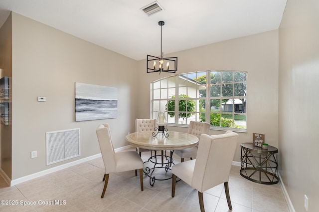 130 Cameron St SE, Palm Bay, FL 32909 - dining area with a chandelier and light tile patterned floors