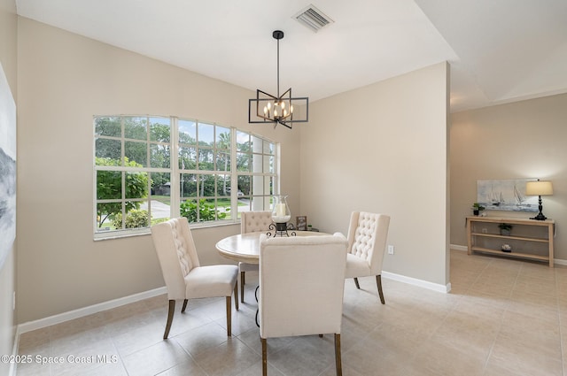 130 Cameron St SE, Palm Bay, FL 32909 - dining area featuring a chandelier and light tile patterned floors