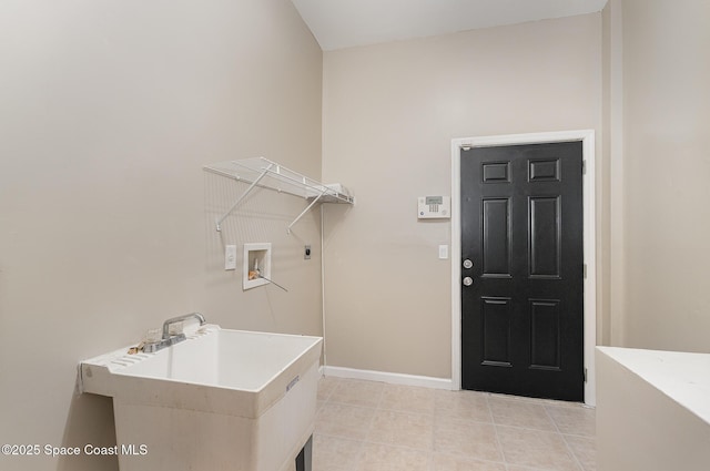 130 Cameron St SE, Palm Bay, FL 32909 - laundry area with hookup for an electric dryer, washer hookup, and light tile patterned floors