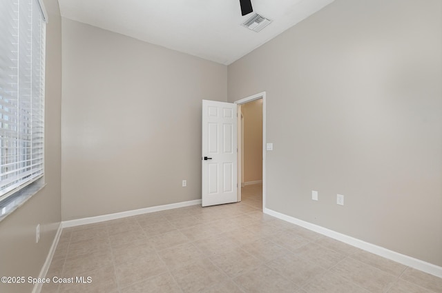 130 Cameron St SE, Palm Bay, FL 32909 - unfurnished room with a ceiling fan, light tile patterned floors, and lofted ceiling