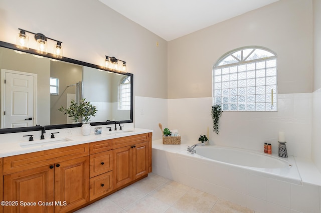 130 Cameron St SE, Palm Bay, FL 32909 - bathroom with a bath, double vanity, and tile patterned flooring