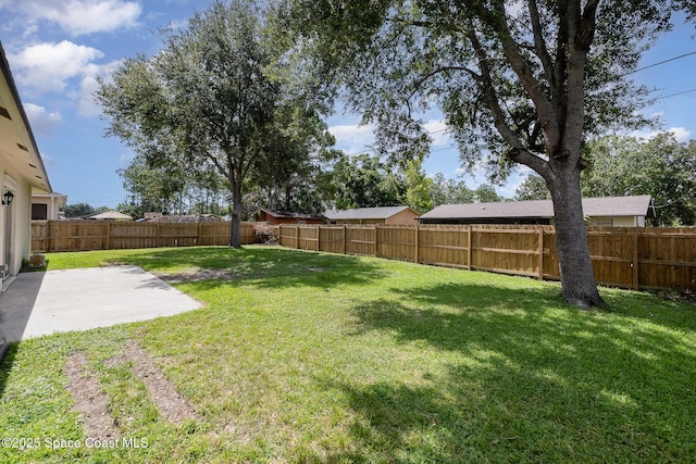 130 Cameron St SE, Palm Bay, FL 32909 - fenced backyard featuring a patio