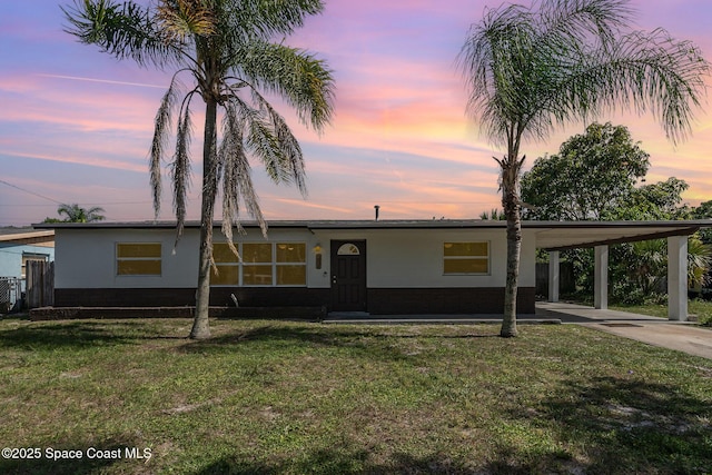 2515 Andrews Ave, Melbourne, FL 32935 - single story home with driveway, a front lawn, and a carport