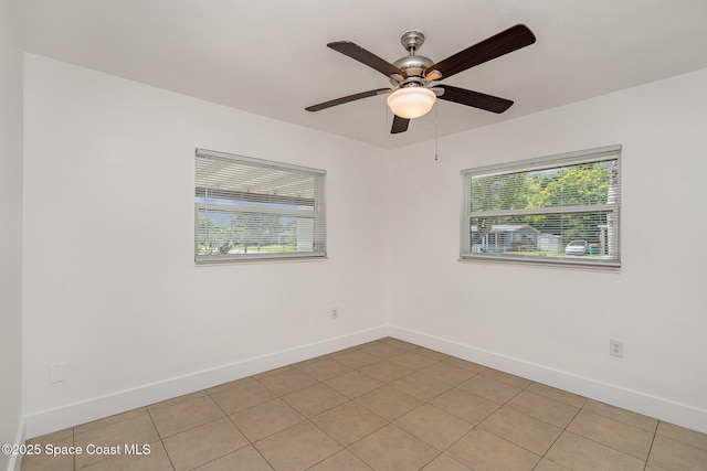 2515 Andrews Ave, Melbourne, FL 32935 - empty room featuring plenty of natural light, light tile patterned floors, and a ceiling fan