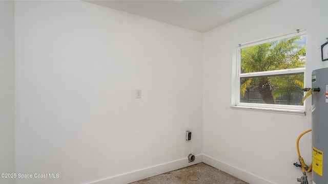 2515 Andrews Ave, Melbourne, FL 32935 - laundry room with baseboards and electric water heater
