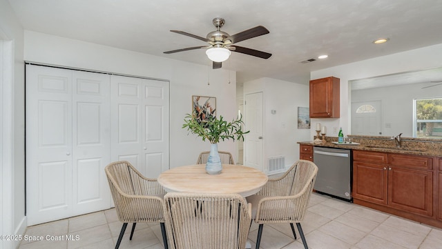 2515 Andrews Ave, Melbourne, FL 32935 - kitchen featuring dishwasher, ceiling fan, light tile patterned floors, brown cabinets, and recessed lighting