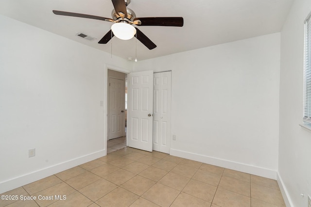 2515 Andrews Ave, Melbourne, FL 32935 - empty room featuring a ceiling fan and light tile patterned flooring