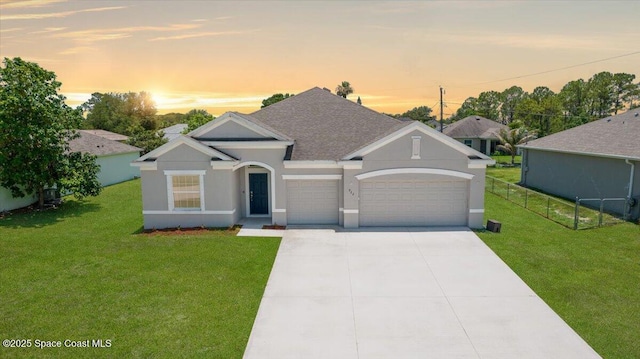 922 Raleigh Rd SE, Palm Bay, FL 32909 - view of front of property with a garage, stucco siding, a shingled roof, and concrete driveway