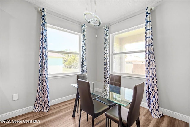 922 Raleigh Rd SE, Palm Bay, FL 32909 - dining space featuring wood finished floors and a textured ceiling