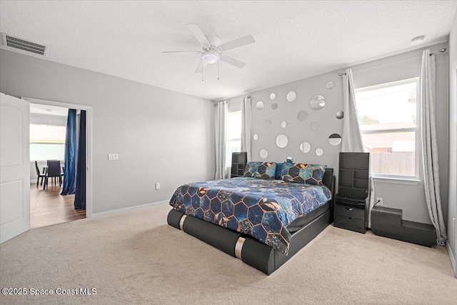 922 Raleigh Rd SE, Palm Bay, FL 32909 - carpeted bedroom featuring ceiling fan and a textured ceiling