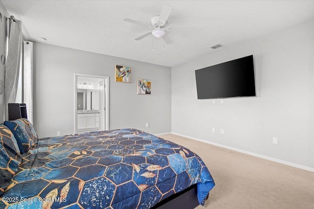 922 Raleigh Rd SE, Palm Bay, FL 32909 - bedroom with carpet floors, a textured ceiling, a ceiling fan, and ensuite bath
