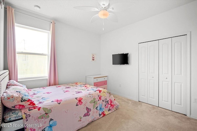 922 Raleigh Rd SE, Palm Bay, FL 32909 - carpeted bedroom featuring a closet and ceiling fan