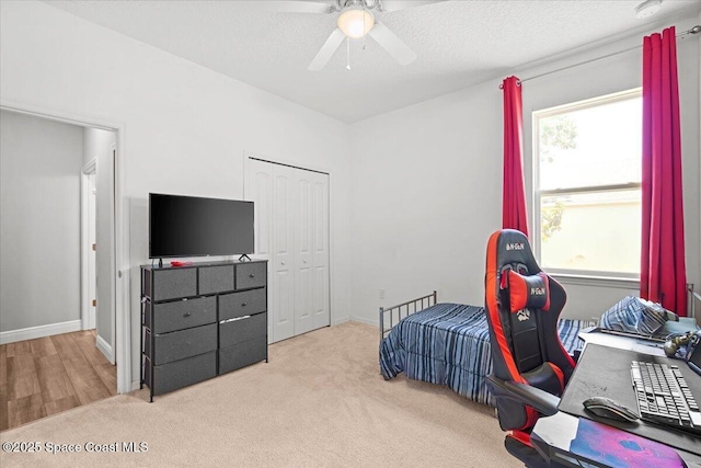922 Raleigh Rd SE, Palm Bay, FL 32909 - bedroom with carpet, a closet, and a ceiling fan