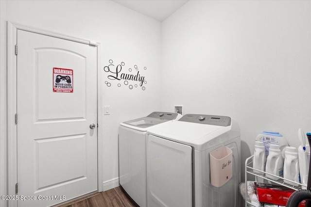 922 Raleigh Rd SE, Palm Bay, FL 32909 - washroom with washer and dryer and dark wood-style floors
