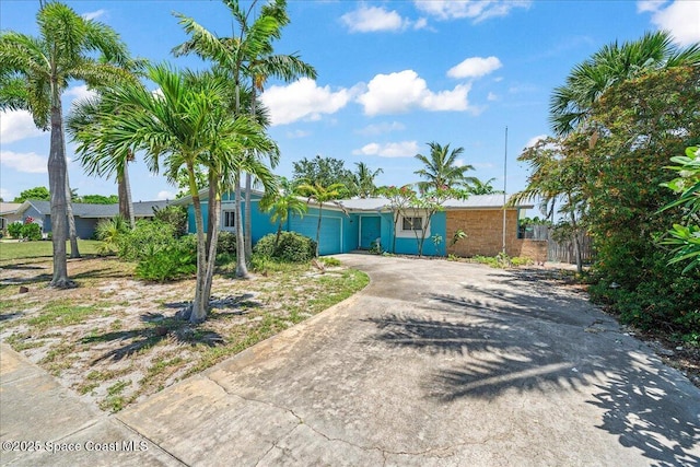 443 Aruba Ct, Satellite Beach, FL 32937 - view of front of property with a garage and driveway