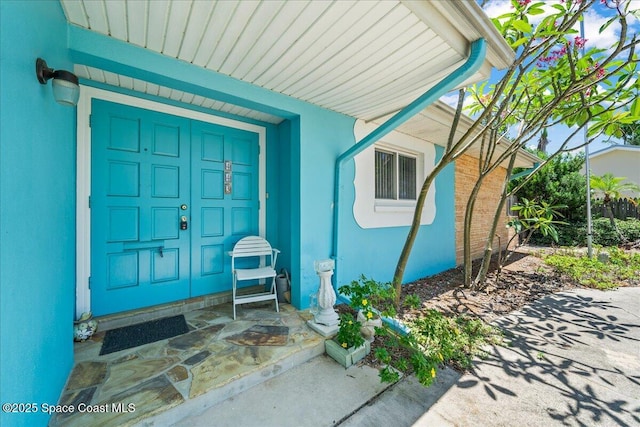 443 Aruba Ct, Satellite Beach, FL 32937 - property entrance with stucco siding