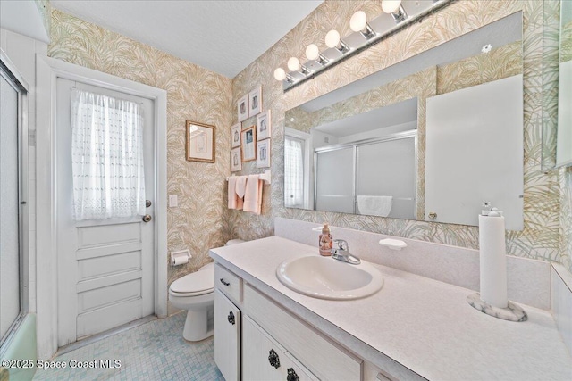 443 Aruba Ct, Satellite Beach, FL 32937 - full bath featuring wallpapered walls, vanity, healthy amount of natural light, and tile patterned flooring
