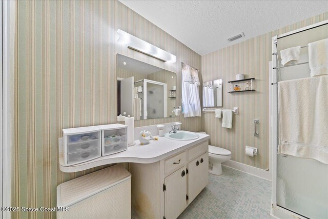 443 Aruba Ct, Satellite Beach, FL 32937 - bathroom featuring vanity, a stall shower, and a textured ceiling