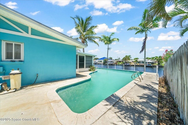 443 Aruba Ct, Satellite Beach, FL 32937 - view of pool with a patio area, a water view, and a sunroom