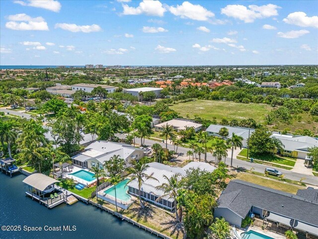 443 Aruba Ct, Satellite Beach, FL 32937 - aerial view of a pool and a nearby body of water