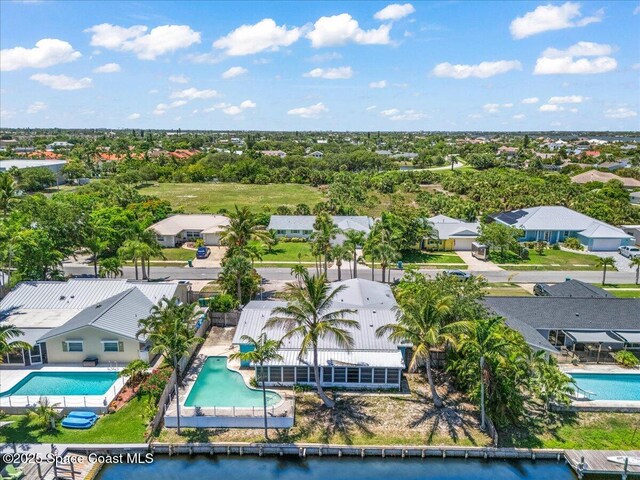 443 Aruba Ct, Satellite Beach, FL 32937 - aerial perspective of suburban area featuring a pool