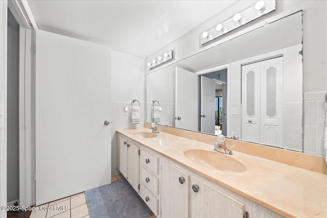 3170 N Atlantic Ave Unit 412, Cocoa Beach, FL 32931 - bathroom with double vanity and tile patterned flooring