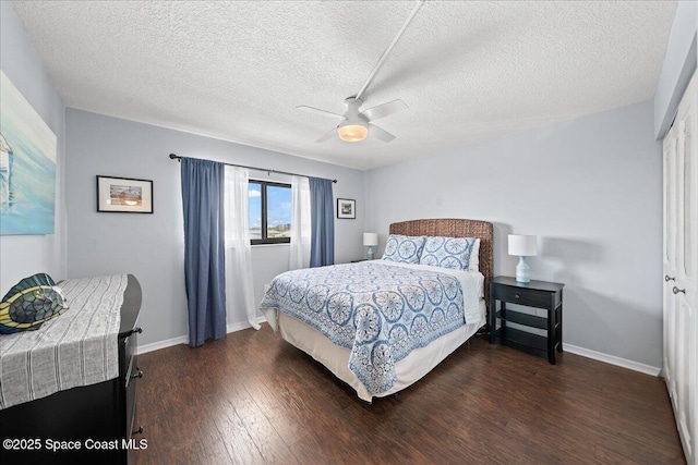 3170 N Atlantic Ave Unit 412, Cocoa Beach, FL 32931 - bedroom with wood finished floors, a textured ceiling, and a ceiling fan