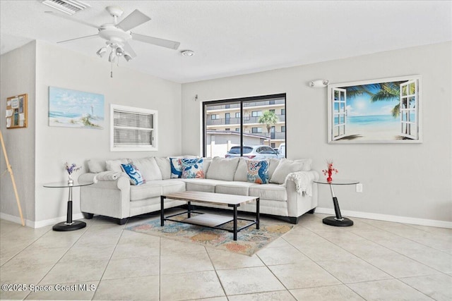 3170 N Atlantic Ave Unit 412, Cocoa Beach, FL 32931 - living area featuring light tile patterned floors and a ceiling fan