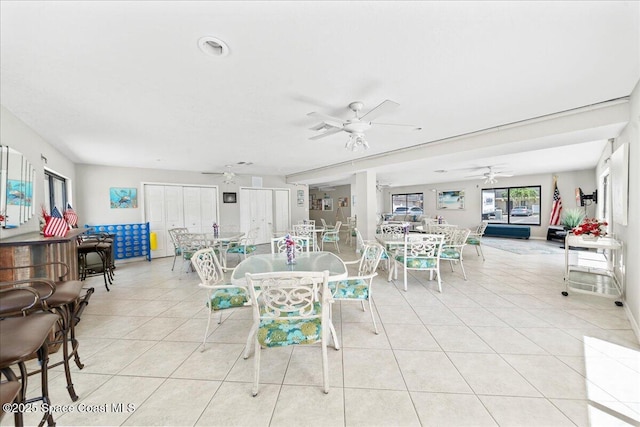 3170 N Atlantic Ave Unit 412, Cocoa Beach, FL 32931 - dining room featuring light tile patterned flooring and ceiling fan