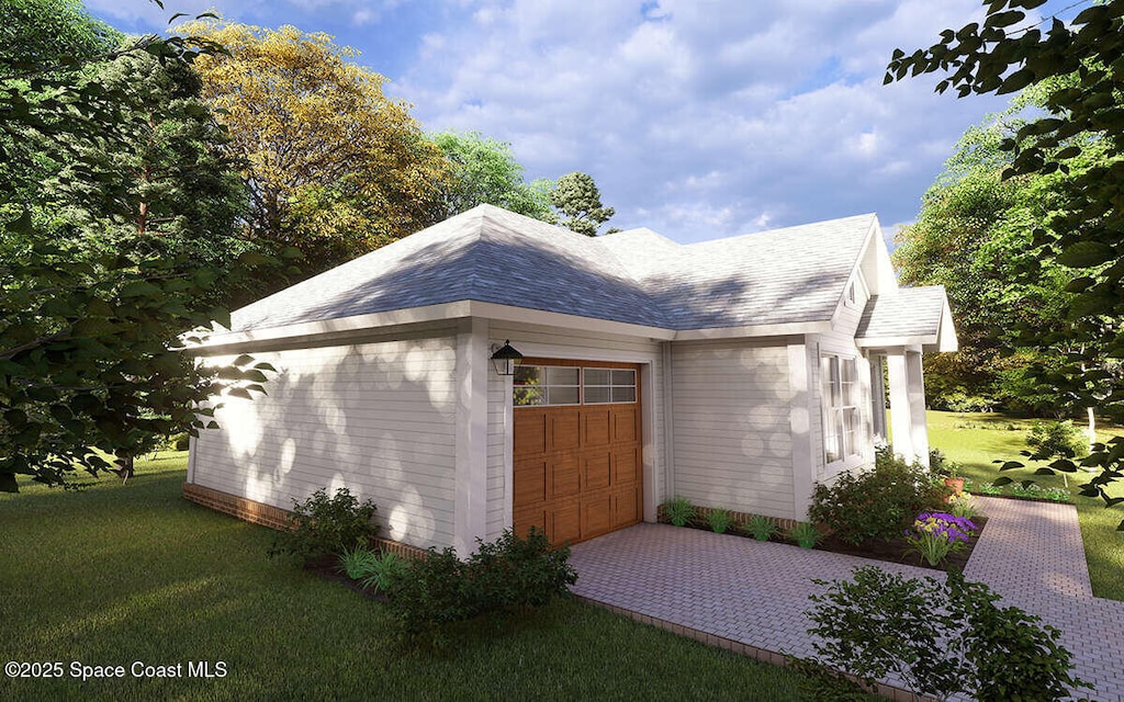 258 Lime St, Cocoa, FL 32926 - view of property exterior featuring an attached garage, a lawn, roof with shingles, and driveway