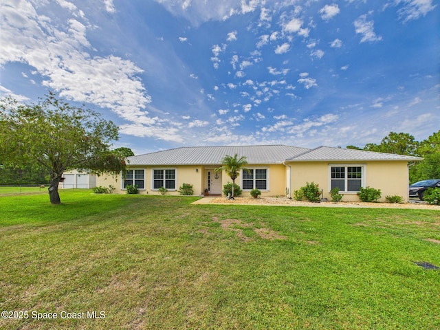 3200 Grant Rd, Grant-Valkaria, FL 32949 - single story home featuring stucco siding, a metal roof, and a front yard