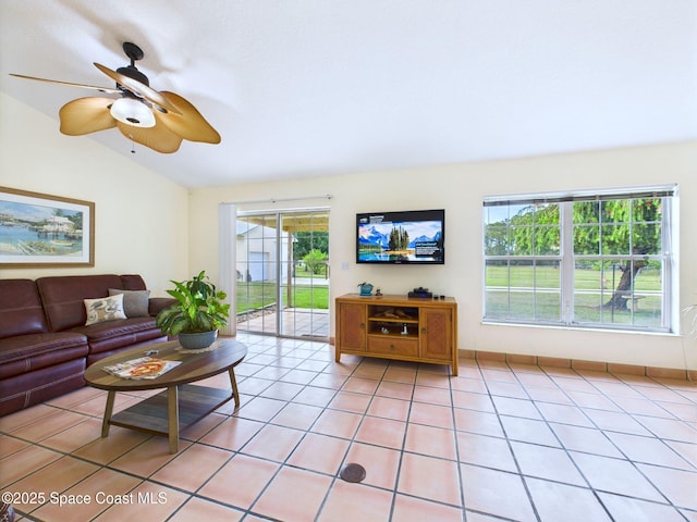 3200 Grant Rd, Grant-Valkaria, FL 32949 - living area featuring vaulted ceiling, light tile patterned flooring, and ceiling fan