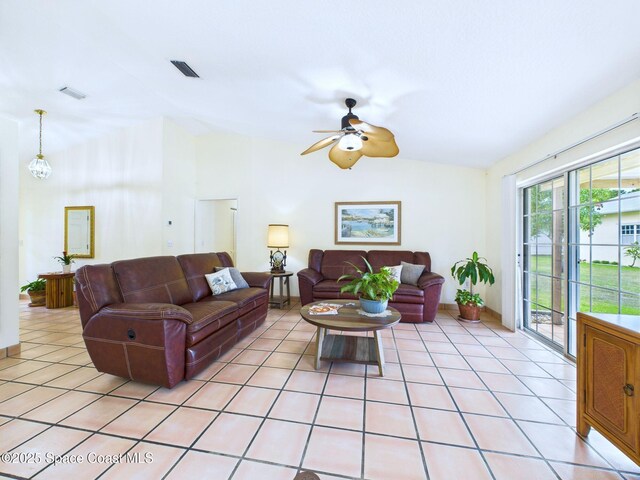 3200 Grant Rd, Grant-Valkaria, FL 32949 - living area with ceiling fan, vaulted ceiling, and light tile patterned floors