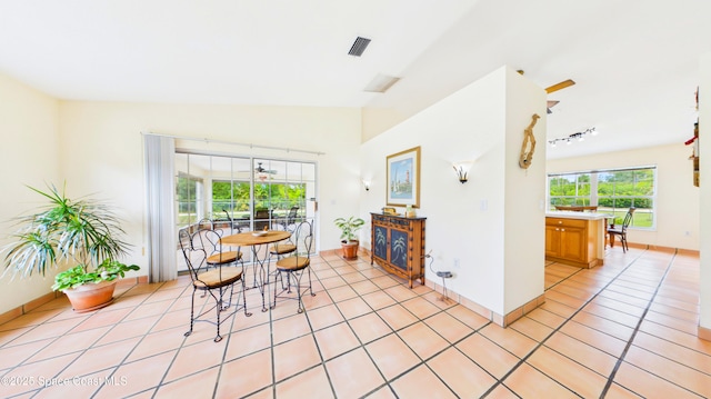 3200 Grant Rd, Grant-Valkaria, FL 32949 - dining area with light tile patterned floors and baseboards