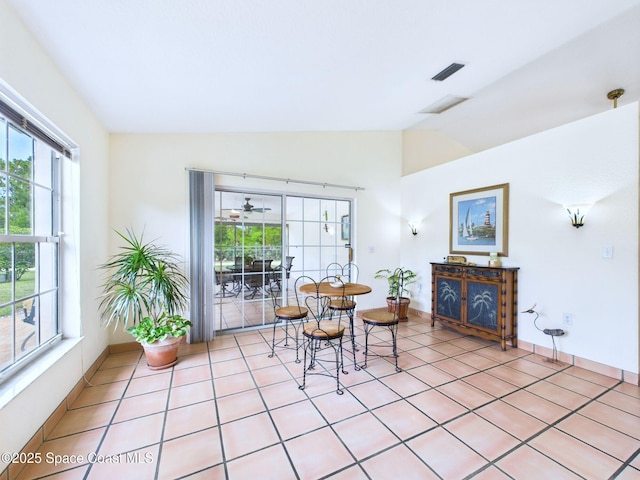 3200 Grant Rd, Grant-Valkaria, FL 32949 - dining room with vaulted ceiling and light tile patterned floors