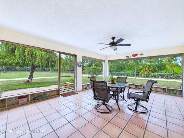 3200 Grant Rd, Grant-Valkaria, FL 32949 - sunroom featuring a ceiling fan and outdoor dining space